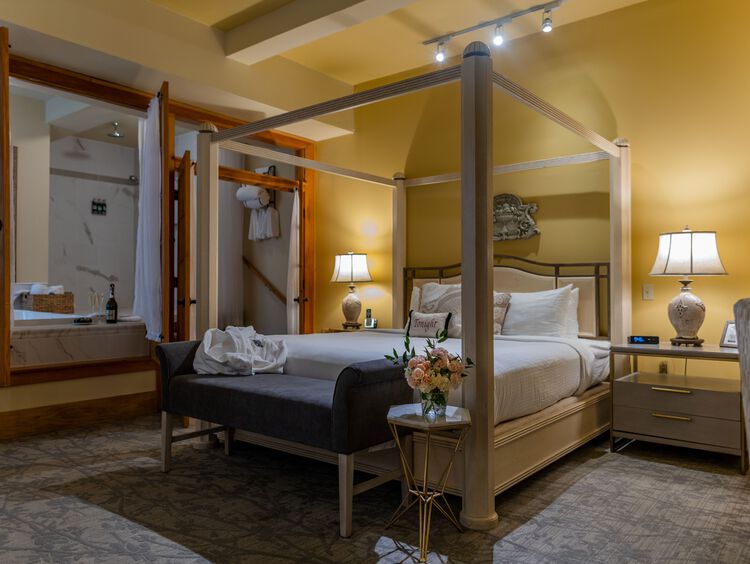 Bed in hotel room with French doors
