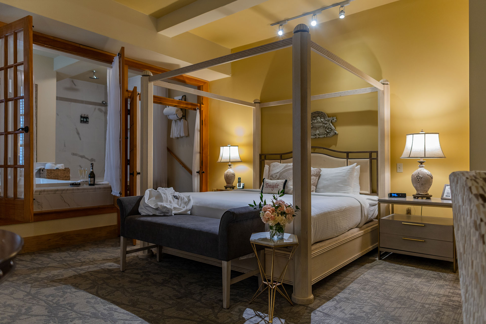 Bed in hotel room with French doors